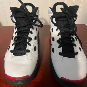 White and Black High-Top Sneakers with Red Accents